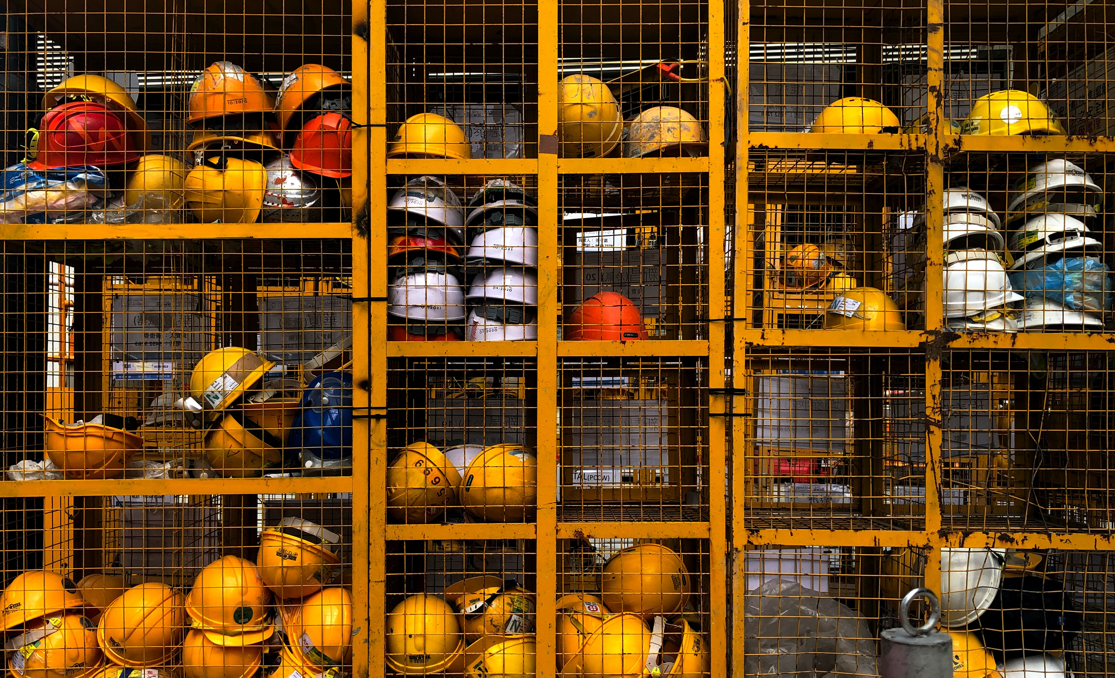 Hard hats in a cage